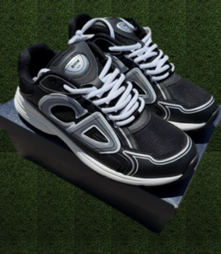 Black and silver running sneakers on turf