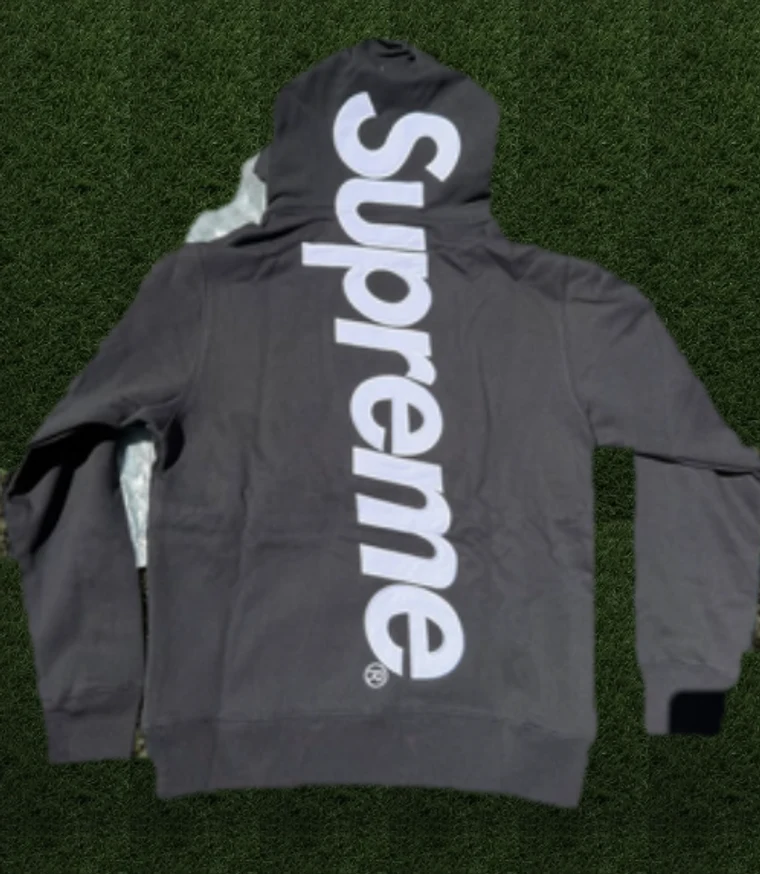Black Supreme hoodie on turf